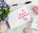 happy birthday card beside flower thread box and macaroons